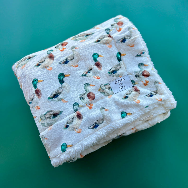 Manta acurrucada de pata de gallo rosa